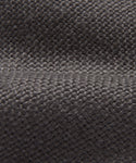 Close-up of the Miramar Chair Slipcover’s dark gray woven fabric, highlighting its textured, grid-like pattern, visible fibers, and a subtle horizontal fold across the center.
