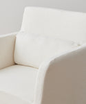 A close-up of the Sunset Dining Arm Chair Slipcover, shown in modern off-white alabaster linen with a matching cushion, set against a plain background.