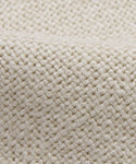 Close-up of the Sunset Dining Arm Chair Slipcover in thick sandstone linen, featuring a beige woven fabric with a textured crisscross pattern that showcases sturdy threads and a natural fiber feel.